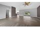 Living area with wood flooring, access to outdoor patio, and an open view into other rooms at 3900 Sw 102Nd Pl, Ocala, FL 34476