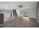Bright open-plan living area with vaulted ceilings and a seamless transition to the kitchen at 3900 Sw 102Nd Pl, Ocala, FL 34476