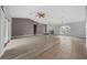Spacious living area with tile, wood-look flooring, and an entryway leading to front door at 3900 Sw 102Nd Pl, Ocala, FL 34476