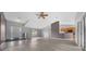 Open-concept floor plan with living area and kitchen featuring hardwood flooring and natural light at 3900 Sw 102Nd Pl, Ocala, FL 34476