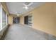 Enclosed porch with ceiling fans and sliding doors to backyard at 3900 Sw 102Nd Pl, Ocala, FL 34476