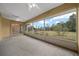 The home has a screened-in porch with a view of the grassy backyard at 3900 Sw 102Nd Pl, Ocala, FL 34476