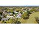 Stunning aerial view showcasing the property's location within a lush neighborhood and golf course community at 3909 River Crest Cir, Leesburg, FL 34748