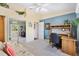Bright bedroom with neutral walls, a ceiling fan, a desk, and a sliding door closet at 3909 River Crest Cir, Leesburg, FL 34748
