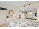 Bright bedroom features a closet with mirrored doors and a view of another bedroom at 3909 River Crest Cir, Leesburg, FL 34748