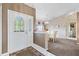 Inviting foyer featuring decorative glass front door and open view to dining area at 3909 River Crest Cir, Leesburg, FL 34748