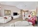 Expansive living room featuring neutral decor and open concept layout with vaulted ceiling at 3909 River Crest Cir, Leesburg, FL 34748