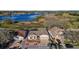 Aerial view of single Gathering home with lush landscaping, a large body of water, and a defined blue lot line at 4818 Sawgrass Lake Cir, Leesburg, FL 34748