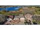 Aerial view of home with mature landscaping and lake view at 4818 Sawgrass Lake Cir, Leesburg, FL 34748