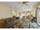 Open living room featuring comfortable seating arrangements, ample natural light, and seamless flow at 4818 Sawgrass Lake Cir, Leesburg, FL 34748