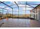Enclosed patio with lake views, tiled floor and expansive screened in area at 4818 Sawgrass Lake Cir, Leesburg, FL 34748