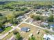 Aerial view of the property and neighborhood surrounded by lush greenery and nearby homes at 4857 Se 137Th Pl, Summerfield, FL 34491