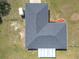 Aerial shot showcases the home's roof, backyard, and landscaping at 4857 Se 137Th Pl, Summerfield, FL 34491