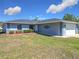 Charming single-story home featuring well-maintained lawn, manicured bushes, and a two car garage at 4857 Se 137Th Pl, Summerfield, FL 34491