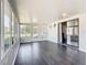 Enclosed patio with multiple windows providing natural light and a view of the backyard at 4857 Se 137Th Pl, Summerfield, FL 34491