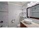 Bathroom features marble tiling, a vessel sink, and modern fixtures at 502 Lake Gracie Dr, Eustis, FL 32726