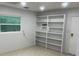 Bright room featuring built-in shelving and a window for natural light at 502 Lake Gracie Dr, Eustis, FL 32726