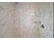 Close-up of the shower featuring marble tiling and modern fixtures at 502 Lake Gracie Dr, Eustis, FL 32726