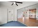 Sunroom shows view of the kitchen with tile floors, large sliding glass door, and ceiling fan at 502 Lake Gracie Dr, Eustis, FL 32726