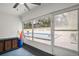 Enclosed sunroom offers a view of the pool, ceiling fan, and pool noodles at 502 Lake Gracie Dr, Eustis, FL 32726