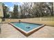 Backyard swimming pool with light tiling and deck at 502 Lake Gracie Dr, Eustis, FL 32726
