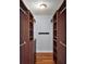 Spacious walk-in closet with custom wooden shelving and hanging racks at 502 Lake Gracie Dr, Eustis, FL 32726