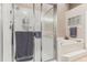 Bathroom with a walk-in shower, a bathtub and a window at 5056 Harbour Dr, Oxford, FL 34484