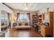 Bright bedroom features laminate floors, versatile seating and closet with mirrored doors at 5056 Harbour Dr, Oxford, FL 34484