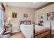 Comfortable bedroom with natural light, warm wood floors and neutral color scheme at 5056 Harbour Dr, Oxford, FL 34484