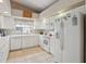 Efficient kitchen featuring white cabinetry, ample counter space, and modern appliances at 5056 Harbour Dr, Oxford, FL 34484