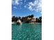 Resort-style community pool features beautiful waterfalls and ample space for swimming at 5056 Harbour Dr, Oxford, FL 34484