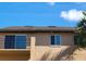 Exterior shot of home showing windows and upper balcony with railing and palm trees at 5214 Via Hacienda Cir # A308, Orlando, FL 32839