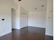 Living room with vaulted ceiling and wood flooring at 5214 Via Hacienda Cir # A308, Orlando, FL 32839