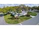 Corner lot single story home with a well manicured lawn, mature landscaping and paved driveway at 5402 Rosewall Cir, Leesburg, FL 34748