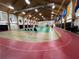 Spacious badminton court with high ceilings and ample lighting at 5402 Rosewall Cir, Leesburg, FL 34748