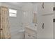 Full bathroom with tub/shower combination, neutral vanity, and functional layout at 5402 Rosewall Cir, Leesburg, FL 34748
