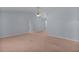 Large bedroom with carpet flooring, a ceiling fan and bright lighting at 5402 Rosewall Cir, Leesburg, FL 34748