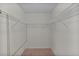 Walk-in closet with shelving for clothing storage at 5402 Rosewall Cir, Leesburg, FL 34748