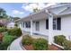 Front porch with columns and a walkway lined with landscaping at 5402 Rosewall Cir, Leesburg, FL 34748