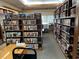 The community library features rows of bookshelves, a comfortable reading space, and a quiet atmosphere at 5402 Rosewall Cir, Leesburg, FL 34748