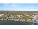 Aerial view displaying the condo building, waterway, and scenic landscape at 601 N Mcdonald St # 208, Mount Dora, FL 32757