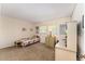 Bedroom with furniture, neutral walls and carpeted floors at 601 N Mcdonald St # 208, Mount Dora, FL 32757