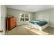 Serene bedroom with ample natural light, comfortable bed, and spacious layout at 601 N Mcdonald St # 208, Mount Dora, FL 32757