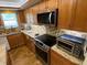 Modern kitchen featuring stainless steel appliances and ample counter space at 601 N Mcdonald St # 208, Mount Dora, FL 32757