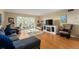 Relaxing living room with plush seating, entertainment center, and serene views at 601 N Mcdonald St # 208, Mount Dora, FL 32757