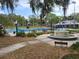 Beautiful park with a fountain, tennis courts, and walking paths, offering a serene outdoor experience at 601 N Mcdonald St # 208, Mount Dora, FL 32757