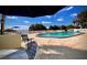 Outdoor pool with lounge chairs and clear blue sky at 601 N Mcdonald St # 208, Mount Dora, FL 32757
