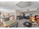 Spacious recreation room featuring multiple seating areas and game tables for residents at 601 N Mcdonald St # 208, Mount Dora, FL 32757