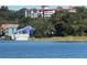 Charming waterfront condos with lush trees and views of the open water create a peaceful escape at 601 N Mcdonald St # 208, Mount Dora, FL 32757