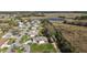 Aerial view showing charming neighborhood homes backing up to Florida wildlife and lakes at 6022 Wilander St, Leesburg, FL 34748